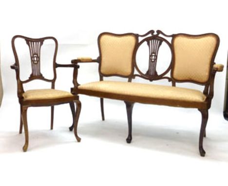 An Edwardian mahogany and upholstered five piece parlour suite including a sofa, carver and three dining chairs CONDITION REP