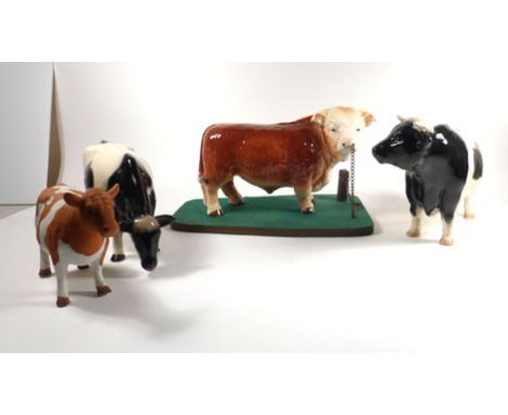 A Melba figure modelled as a Hereford bull, h. 16.5 cm including base, together with three further models (4)