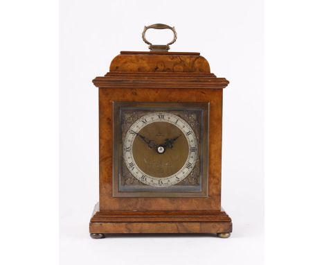 A 20th century mantle clock the, Elliot movement within a walnut case with brass bun feet, retailed by John Bull, h. 21 cm, w