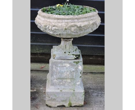 A reconstituted stone garden planter, on a pedestal base, 84cm tall