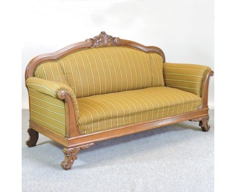 An early 19th century green upholstered scroll end sofa, 200cm