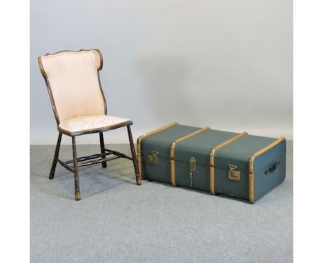 A 1950's wooden bound travelling trunk, together with a side chair