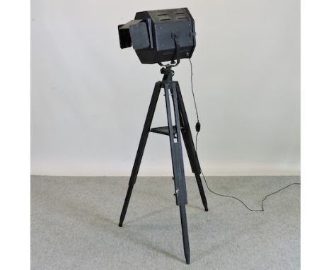 A vintage 'Strand' electric stage light, on a tripod base, 140cm tall