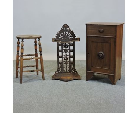 A mahogany pot cupboard, 44cm tall, together with a cast iron stick stand, stamped FALK 256 and a pine stool