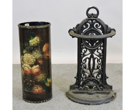 An ornate cast iron stick stand, 74cm tall, together with a wooden stick stand painted with flowers