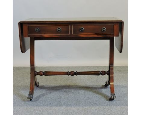 A reproduction yew wood leather top sofa table, 148cm overall