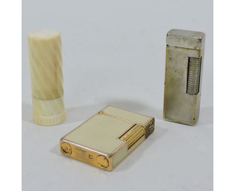 A Dupont lighter, together with a plated lighter, stamped Dunhill, and another