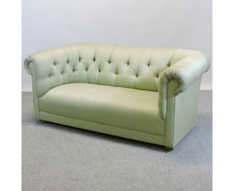 A 1920's green upholstered button back two seater Chesterfield sofa, 160cm