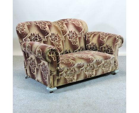 A 1930's brown floral upholstered drop end sofa, on painted feet, 144cm 