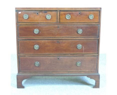 A George III mahogany and boxwood strung chest, containing two short over three long drawers, on bracket feet, 106cm