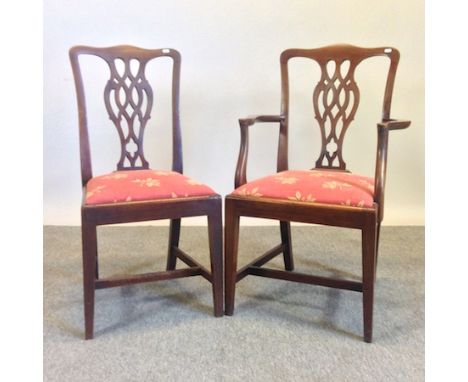 A set of six George III mahogany dining chairs, of Chippendale design, to include a pair of carvers