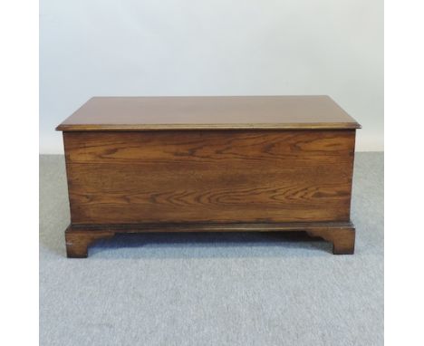 An oak blanket box, on bracket feet, 105cm