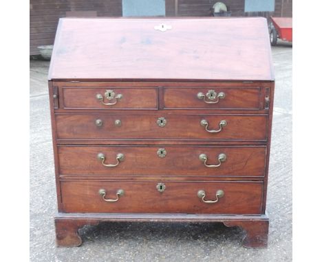 A George III mahogany bureau, on bracket feet, 101cm