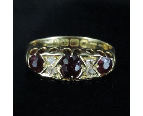 An 18 carat gold ruby and diamond dress ring, boxed