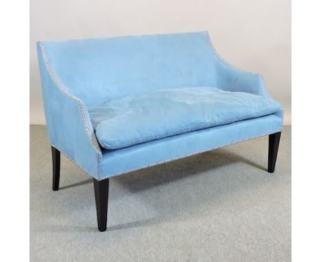 A Georgian style blue upholstered sofa, on square tapered legs, 142cm