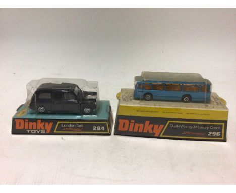 Dinky London Taxi No.284, Duple Viceroy 37 luxury coach No.296 in original blister packs (2)