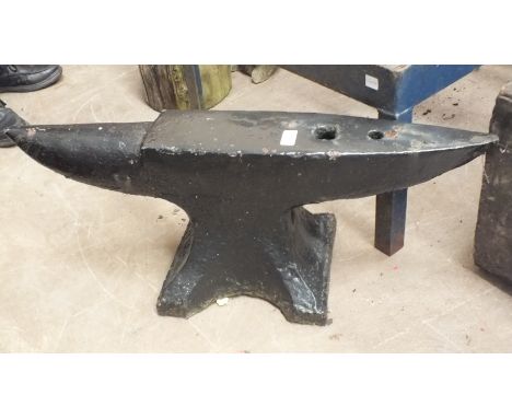 A large iron anvil, 81cm wide, 30cm high, an iron pump and a vintage mechanical hoe, (3). 