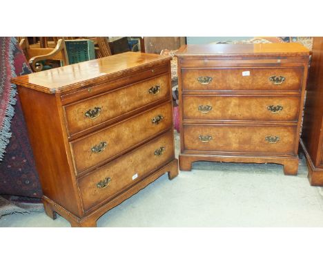 A pair of reproduction Georgian-style bachelors chests, each with brushing slide and three cockbeaded drawers, on bracket fee