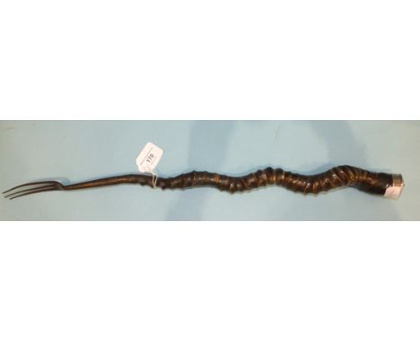 A 19th century steel toasting fork with antelope horn handle and plated mount, 61cm long. 