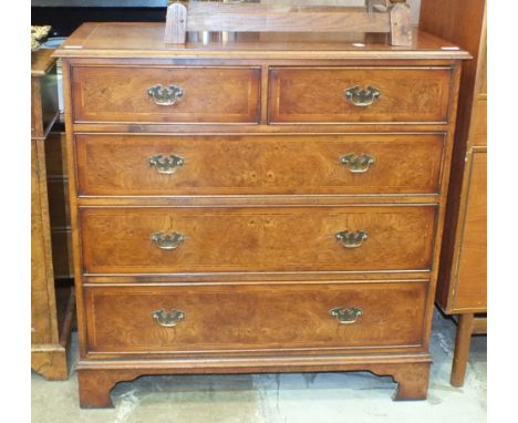 A reproduction burr walnut and cross-banded chest of two short and three long cockbeaded drawers, on bracket feet, 100cm wide