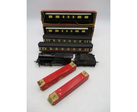 A Trix Twin Railway OO gauge "Compound" British Rail black locomotive with tender (No 41062), along with four coaches includi