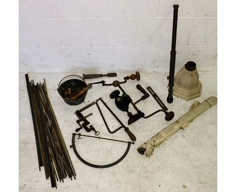 A collection of various vintage tools, stair rods, hopper etc