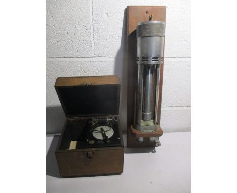 A Western Electric Co. crystal receiving set along with a laboratory max/min thermometer by Casella