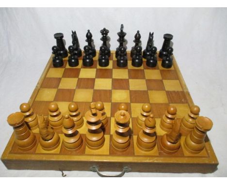 An oversized vintage wooden chess set