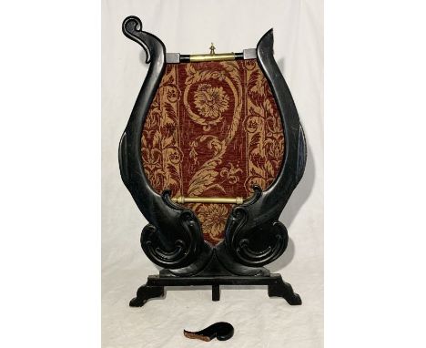 An Art Nouveau ebonised fire screen - damage to top as shown