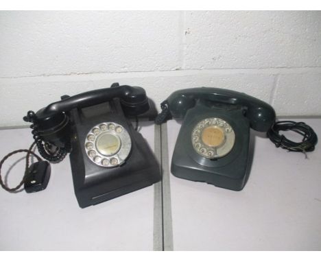 Two vintage telephones circa 1970, one black one green .
