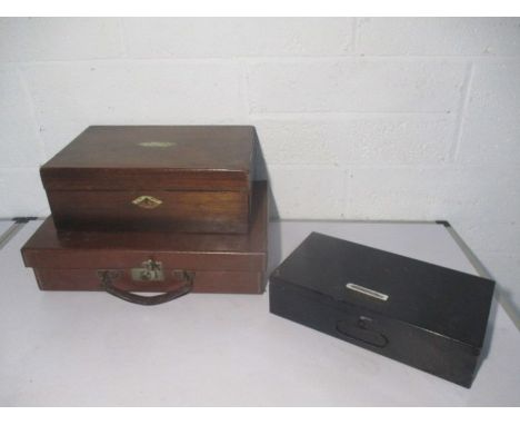 A wooden box with mother of pearl inlay, a metal Air Raid Precaution (ARP) home first aid kit, plus a vintage briefcase.