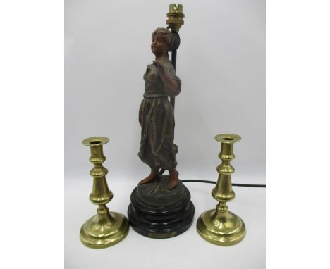 A spelter lamp after Rousseau "Faneuse" along with a pair of brass candlesticks