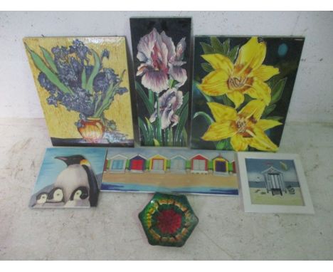 A collection of ceramic picture tiles. 
