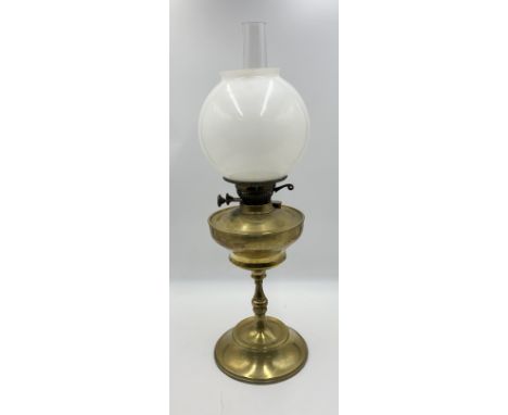 A turn of the century brass oil lamp