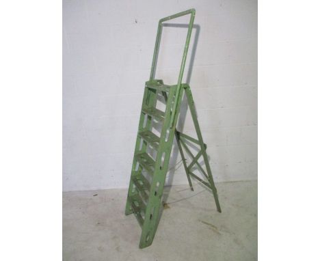 A vintage green painted step-ladder