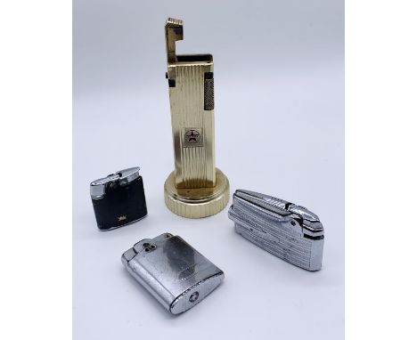 A Cygnus table lighter along with three Ronson lighters