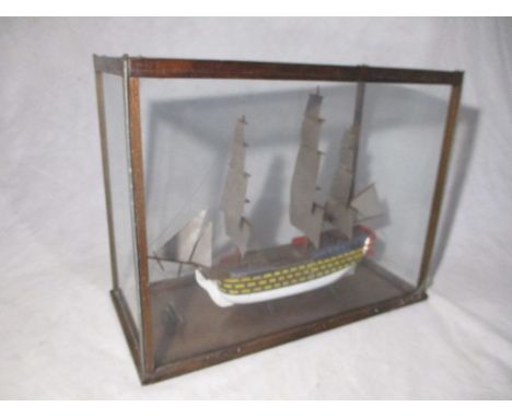A glass cased model of HMS Victory