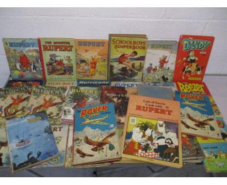 A collection of vintage annuals including Rupert The Bear, Dandy, Beano, The Rover Boy for Boys, The Beezer, School Boys Bump