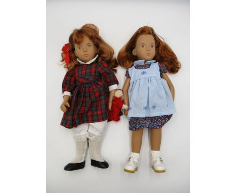 Two vintage unboxed Sasha dolls, one in a tartan dress