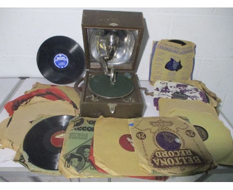 A portable Decca Junior gramophone along with a quantity of 78 speed records