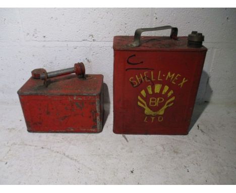 Two vintage red petrol cans, one marked Shell-Mex Ltd.