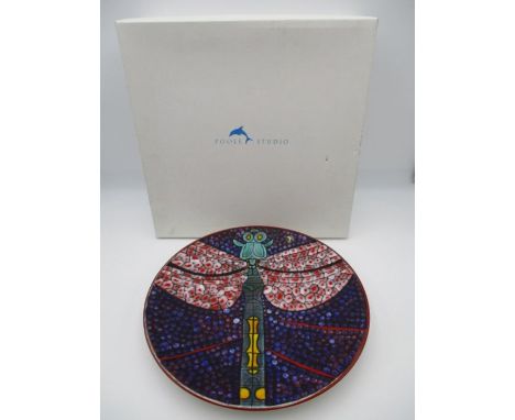 A boxed limited edition Poole Pottery Studio charger designed by Tony Morris, decorated with a central dragonfly in red, purp