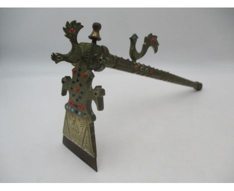 A brass reproduction Viking axe decorated with cockerels 