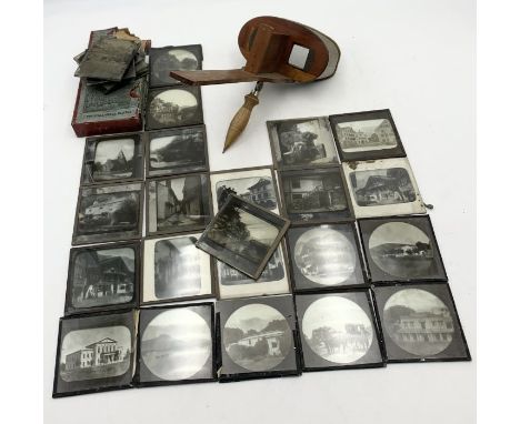 A stereoscopic viewer along with a quantity of magic lantern vintage slides some showing scenes from Brienz, Switzerland.