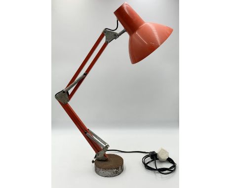 A vintage red anglepoise lamp 