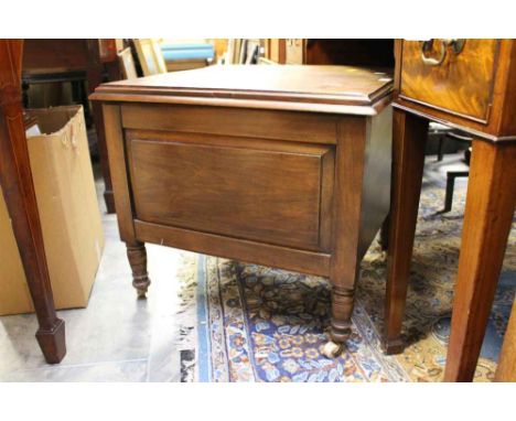 A Victorian beech commode, the lid enclosing a ceramic pot and cover 