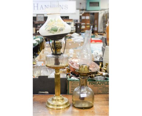 A Hinks No. 2 Duplex glass oil lamp with a Matador Brenner brass base oil lamp having glass reservoir, each with a glass chim