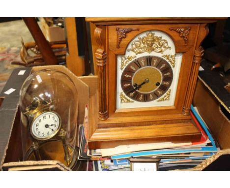 A brass skeleton clock; brass carriage clock; oak cased mantel clock; Commemorative magazines (one box) 