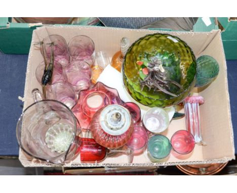A box of coloured glassware, including small Cranberry glass and brass oil lamp, a Venetian green, gold and white glass, part