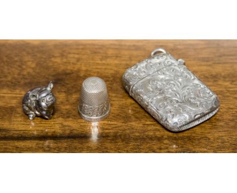A Victorian silver vesta, London 1891, 1.03 ozt approx; a 925 silver Pig netsuke; a sterling silver thimble (3) 